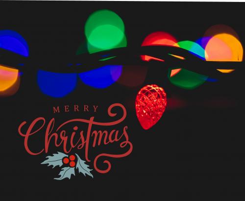 Merry Christmas in red below multi-colored string lights on a black background